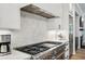 Modern kitchen with stainless steel appliances and white cabinetry at 475 Rose Garden Ln, Alpharetta, GA 30009