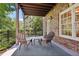 Covered patio with seating area, perfect for relaxing outdoors at 475 Rose Garden Ln, Alpharetta, GA 30009