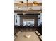A stylish bar area with a billiard table, bar stools, and a full beverage fridge for entertaining at 923 Little Darby Ln, Suwanee, GA 30024
