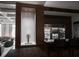A modern bar area with a custom beer tap and glass door beverage coolers for entertaining guests at 923 Little Darby Ln, Suwanee, GA 30024