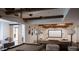 A spacious basement with a pool table, projector screen, and comfortable seating for relaxation and entertainment at 923 Little Darby Ln, Suwanee, GA 30024