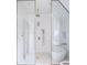 Luxurious bathroom features a stand alone tub, walk-in shower, and neutral tile at 923 Little Darby Ln, Suwanee, GA 30024