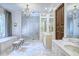Elegant Primary bathroom features dual vanities, a soaking tub, and frameless glass shower at 923 Little Darby Ln, Suwanee, GA 30024