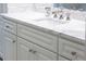 Bathroom vanity with white cabinets and a marble countertop at 923 Little Darby Ln, Suwanee, GA 30024