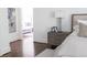 Bright bedroom with neutral decor, and hardwood floors at 923 Little Darby Ln, Suwanee, GA 30024