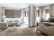 Spacious bedroom with neutral decor, bamboo blinds, and open windows allowing natural light at 923 Little Darby Ln, Suwanee, GA 30024