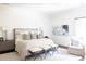 Bright bedroom features neutral colors, a decorative bench, and large windows at 923 Little Darby Ln, Suwanee, GA 30024