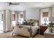 Light and airy bedroom with custom bed, stylish nightstands, and modern ceiling fan at 923 Little Darby Ln, Suwanee, GA 30024