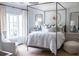 Bedroom with a four-poster bed and neutral colors, creating a restful space at 923 Little Darby Ln, Suwanee, GA 30024