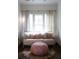Comfortable bedroom featuring a cozy seating area, great natural lighting, and designer curtains at 923 Little Darby Ln, Suwanee, GA 30024