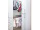 Organized walk-in closet with custom shelving and hanging rods for ample storage at 923 Little Darby Ln, Suwanee, GA 30024