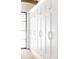 Spacious closet with custom built-ins and bronze hardware, ideal for storage at 923 Little Darby Ln, Suwanee, GA 30024
