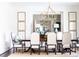 Elegant dining room featuring a large table, stylish chairs, and decorative accents at 923 Little Darby Ln, Suwanee, GA 30024