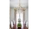 Large, ornate gold chandelier illuminates dining room at 923 Little Darby Ln, Suwanee, GA 30024