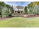 Two-story house with stone accents and landscaping at 923 Little Darby Ln, Suwanee, GA 30024