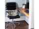 Contemporary home office featuring a sleek desk and comfortable chair, ideal for a productive workspace at 923 Little Darby Ln, Suwanee, GA 30024