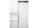 Custom white kitchen cabinets with large fridge at 923 Little Darby Ln, Suwanee, GA 30024