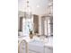 Kitchen featuring island with sink, marble countertops, and pendant lights at 923 Little Darby Ln, Suwanee, GA 30024