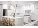 Spacious kitchen with island seating and pendant lighting at 923 Little Darby Ln, Suwanee, GA 30024