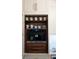 Convenient coffee bar featuring white cabinetry with walnut accents and built-in Miele coffee machine at 923 Little Darby Ln, Suwanee, GA 30024