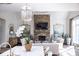 Bright and inviting living room with stone fireplace and view of the kitchen area at 923 Little Darby Ln, Suwanee, GA 30024
