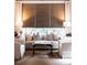Bright living room featuring a sofa, natural window blinds, and neutral color palette at 923 Little Darby Ln, Suwanee, GA 30024