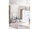 Bright living room featuring a stone fireplace and view of the kitchen at 923 Little Darby Ln, Suwanee, GA 30024