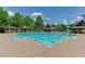 Resort-style pool with spacious deck and lounge chairs at 923 Little Darby Ln, Suwanee, GA 30024