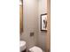Stylish powder room with patterned wallpaper, modern fixtures, and elegant decor at 923 Little Darby Ln, Suwanee, GA 30024