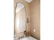 Stylish powder room featuring unique wallpaper, framed mirror, and designer fixtures at 923 Little Darby Ln, Suwanee, GA 30024
