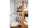 Charming reading nook with a clear hanging chair and built-in bookshelves next to the bunk beds at 923 Little Darby Ln, Suwanee, GA 30024
