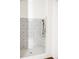 Stylish shower featuring patterned tile, bronze shower head, and white shiplap paneling at 923 Little Darby Ln, Suwanee, GA 30024