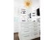 Walk-in closet featuring custom cabinets, shelving, and ample storage solutions at 923 Little Darby Ln, Suwanee, GA 30024