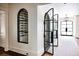 Built-in wine cellar with arched glass door at 923 Little Darby Ln, Suwanee, GA 30024