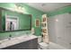 Bathroom with double vanity, marble countertop, and a shower/tub combo at 107 Watson Se Cir, Atlanta, GA 30317