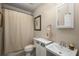 Small bathroom with a toilet, sink, and shower at 107 Watson Se Cir, Atlanta, GA 30317