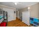 Bedroom with hardwood floors, double doors, and a built-in armoire at 107 Watson Se Cir, Atlanta, GA 30317