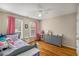 bedroom with hardwood floors, gray dresser and pink accents at 107 Watson Se Cir, Atlanta, GA 30317