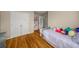 bedroom with hardwood floors, built-in shelving, and double doors at 107 Watson Se Cir, Atlanta, GA 30317