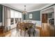 Elegant dining room with hardwood floors, a wood table and gray walls at 107 Watson Se Cir, Atlanta, GA 30317