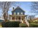 Charming two-story home with a wrap-around porch and well-manicured landscaping at 107 Watson Se Cir, Atlanta, GA 30317