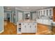 Open concept kitchen with large island, white cabinets, and hardwood floors at 107 Watson Se Cir, Atlanta, GA 30317