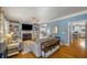 Bright living room features hardwood floors, fireplace, built-in shelves and large windows at 107 Watson Se Cir, Atlanta, GA 30317