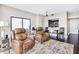 Spacious living room with leather recliners and city views at 1280 W Peachtree Nw St # 3902, Atlanta, GA 30309