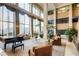 Elegant lobby with comfortable seating, high ceilings, and a grand piano at 1280 W Peachtree Nw St # 3902, Atlanta, GA 30309