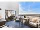 Private patio with outdoor furniture and city views at 1280 W Peachtree Nw St # 3902, Atlanta, GA 30309