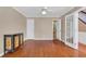 Hardwood floor bedroom with built-in shelving and French doors at 1943 Ivy Branch Ct, Loganville, GA 30052