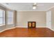 Spacious bedroom with hardwood floors and large windows at 1943 Ivy Branch Ct, Loganville, GA 30052