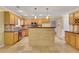 Kitchen island with granite countertop and decorative tile backsplash at 1943 Ivy Branch Ct, Loganville, GA 30052