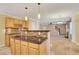 Open kitchen with breakfast bar and view into Gathering room at 1943 Ivy Branch Ct, Loganville, GA 30052